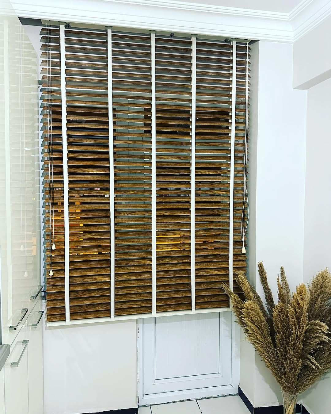 Close-up view of wooden Venetian blinds on a window